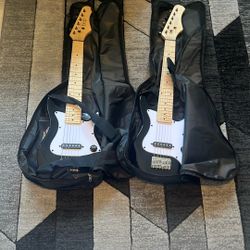 2 Kids Electric Guitars Comes With Tuner A Guitar Pic And Replacement Strings Both Are Tuned