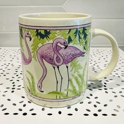 Vintage flamingos coffee mug. 12 oz. 4” tall. Tropical design with parrot on the back side.