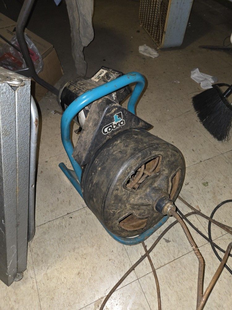 This is a Cobra Mighty-Rooter drain cleaning machine.