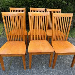 Six wooden chairs