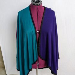 Multi-colored Cape with black edging. One size fits all. 