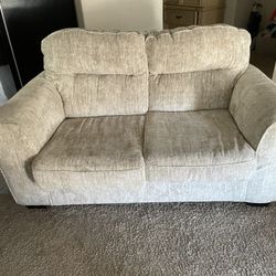 Loveseat And A Chair With Footstool