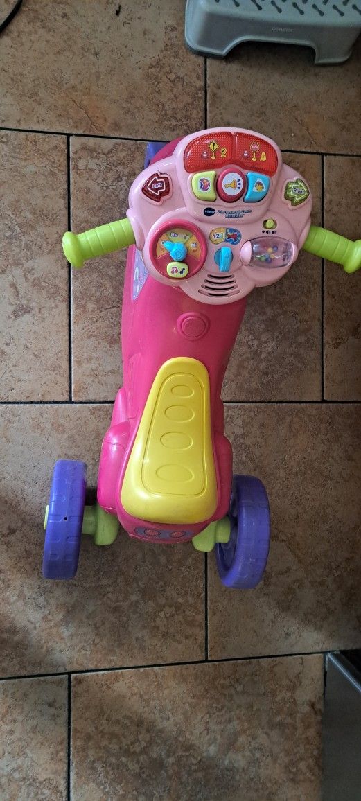 V Tech 2 and 1 learning zoom motorbike.