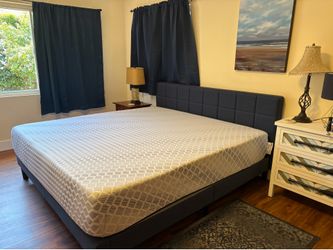 Blue upholstered Cal King platform bed frame