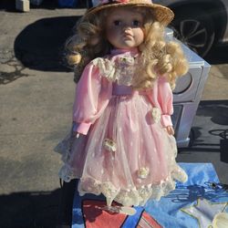 Porcelain doll with stand