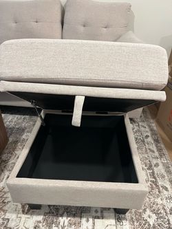 Beige fabric sectional sofa with storage ottoman