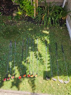 Assorted golf clubs