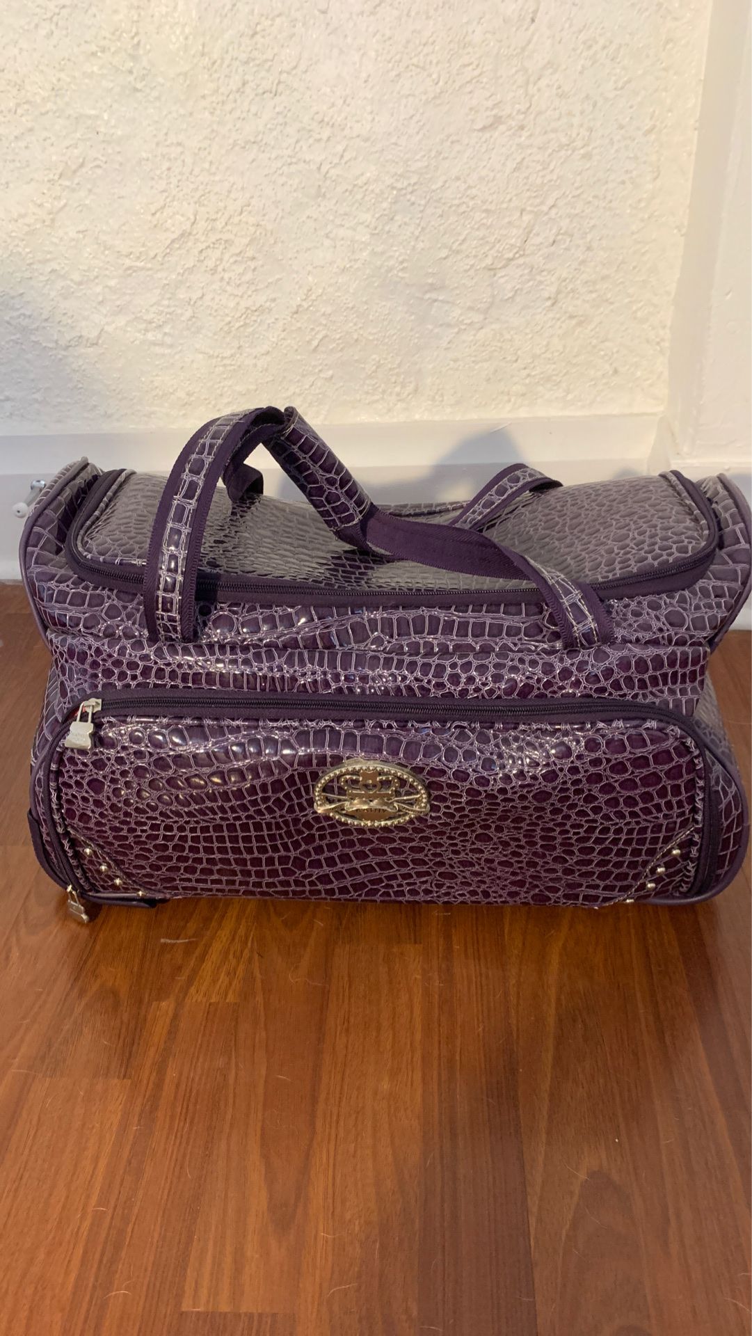 Purple alligator skin rolling bag