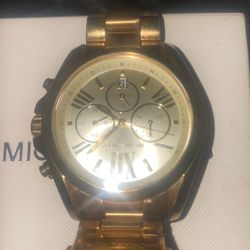 Unisex Michael Kors’s gold watch retail for 350. 
