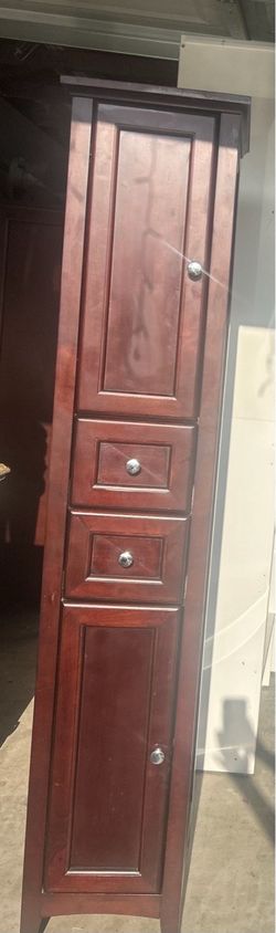 tall cherry wood storage/linen cabinet