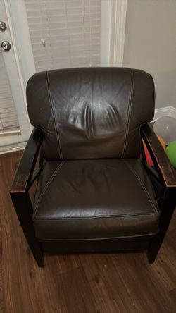 Brown leather and wood chair