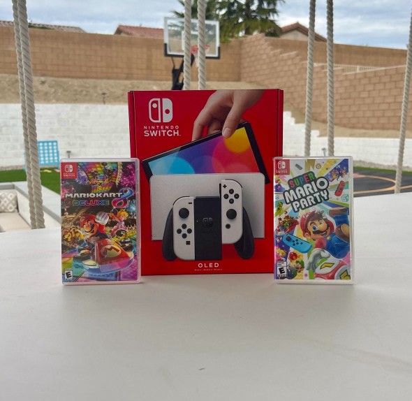 Nintendo Switch Oled with super Mario party and Mario kart deluxe 8 Floor Model