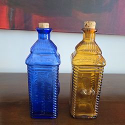 Vintage Glass bottles: Perrine's Apple Ginger bitters bottle (cobalt blue) and Gondetti's bitters bottle (amber)