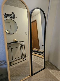 Two full-length floor mirrors