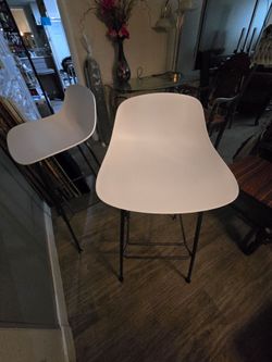 2 white bar stools