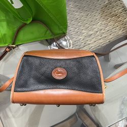 black & tan pebble‑grain Dooney & Bourke crossbody bag
