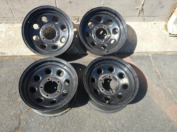 15x7 black steel wheels. 5 on 5.5 lugs, Dodge, Ford, Jeep, more