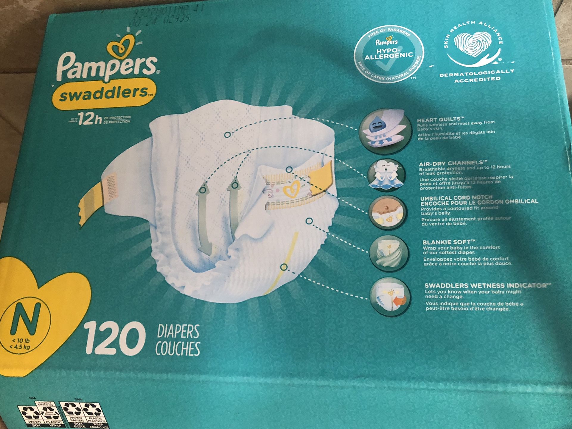 Box of Newborn Size Pampers diapers.