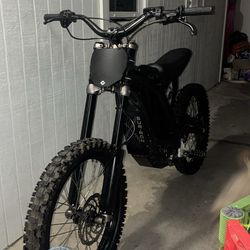 Surron is somewhat modified, serves well, runs well, new tires