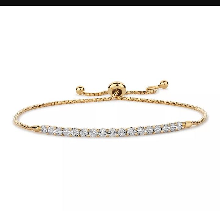 Designed with a row of scintillating round-cut diamonds, this 14k gold over silver bracelet is simply lovely.