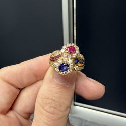 Stunning yellow gold ring containing natural Diamonds, Ruby, and Sapphire
