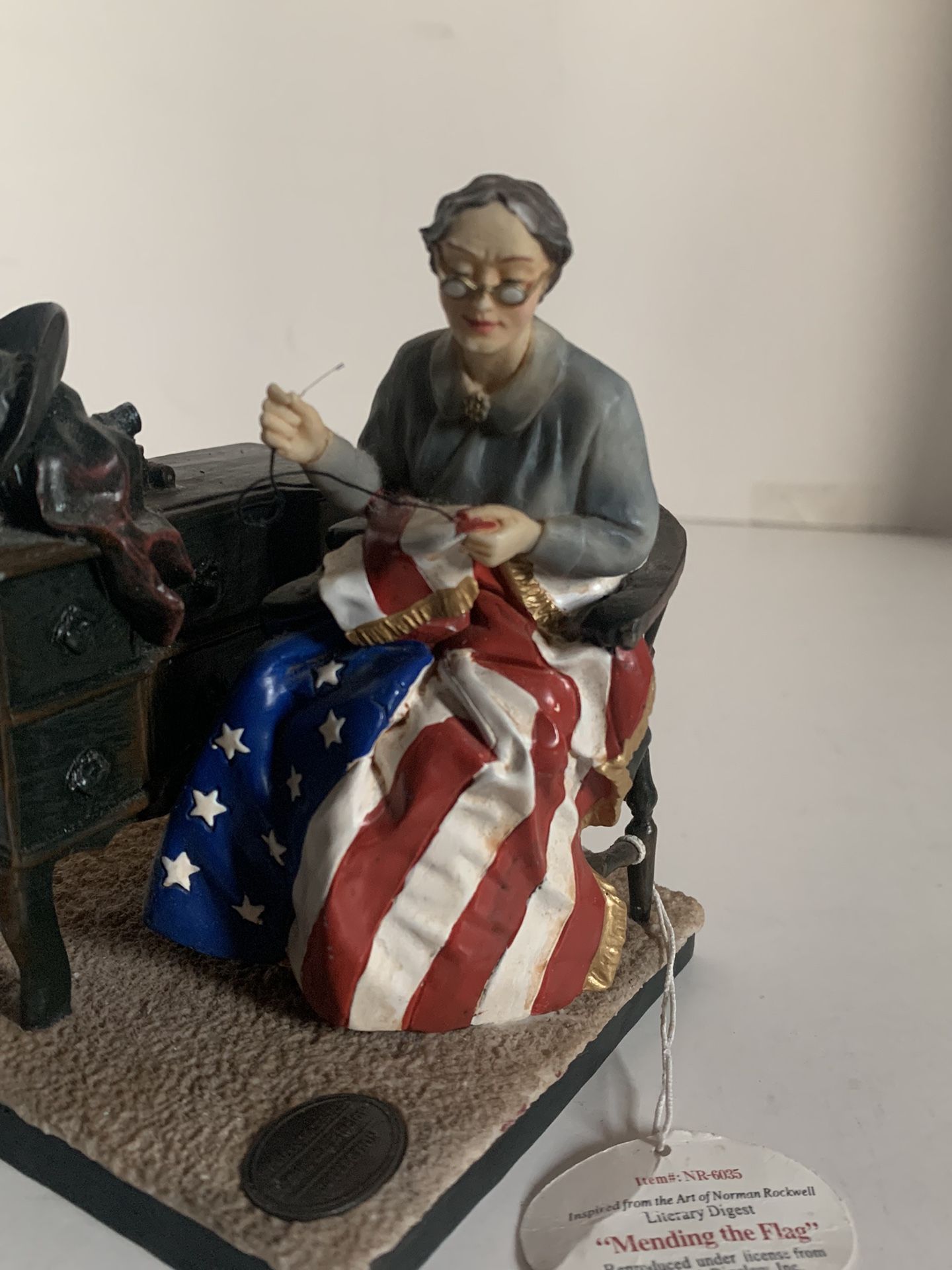 “Mending The Flag" Norman Rockwell Brown and Bigelow