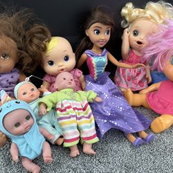 Baby Dolls And Dolls And A Carrying Seat