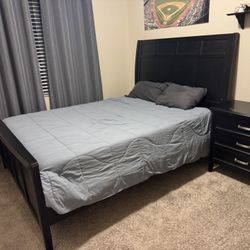 Black queen Sized Sleigh Bed, Dresser w/mirror and Nightstand