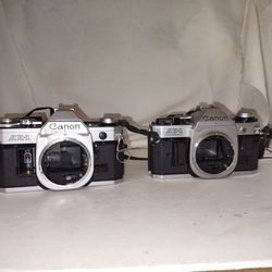 2 Canon Film Cameras AE-1 Program & AE-1 35mm SLR  (contact info removed) &(contact info removed) no lens Parts Only! 