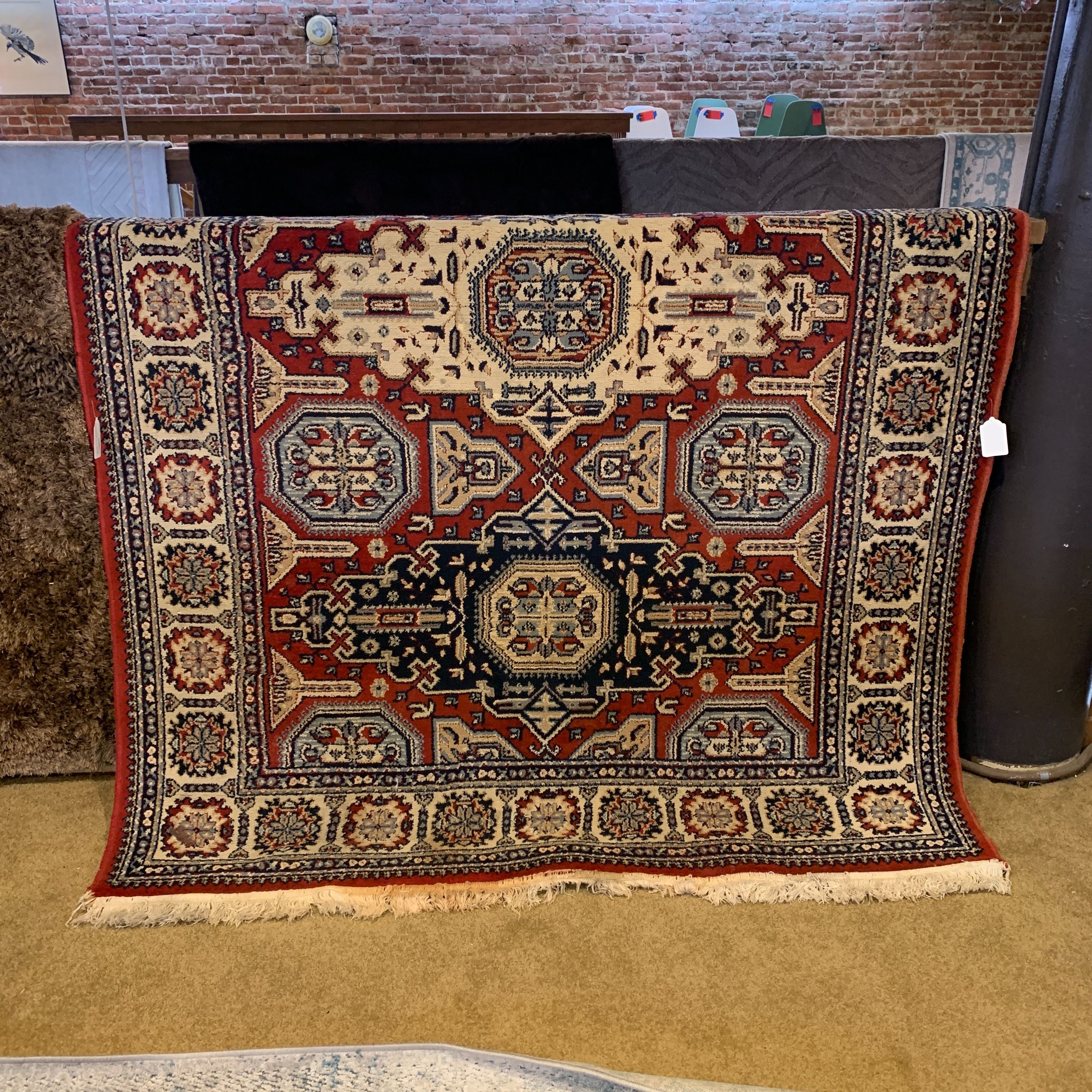 92″ x 62″ Red and Navy Ornate Rug