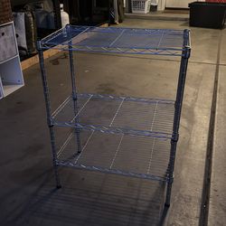 Three tiered metal storage shelf