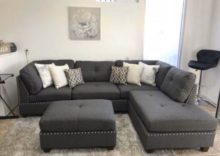 New in box grey sectional sofa ottoman included/ reversible chaise 104”x75”