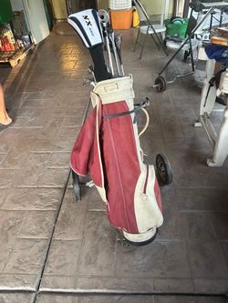 Vintage Golf Bag with Clubs and Cart and golf balls