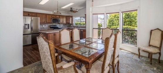Wood and glass table with 8 chairs