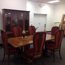Dining table with two leafs, four chairs, two carvers, and a display hutch with two shelves, two cupboards and three dove tail drawers
