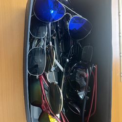 Lot Of Sunglasses And Different Glasses 