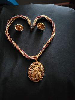These are gold-plated Indian  jewellery necklace and earring sets. NEW