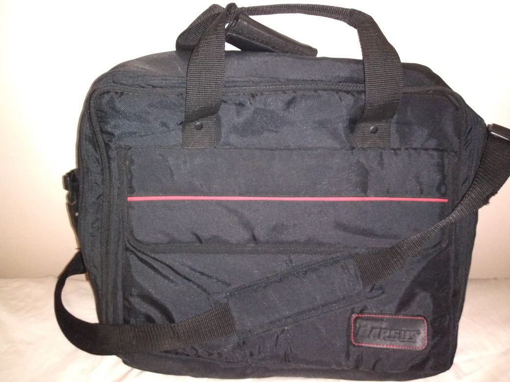 Various laptop cases, backpacks, duffle bags, rolling luggage, totes.