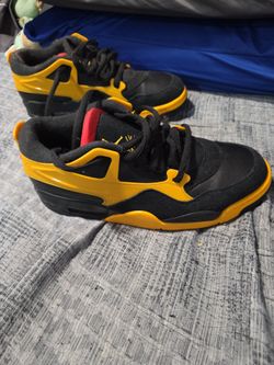 Nike Air Jordan 4 RM sneaker in a "Bruce Lee"