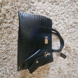 Black and gold women's handbag