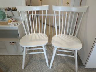 2 Modern Ashley white dining chairs