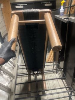 Wood bench with black roven rope seat