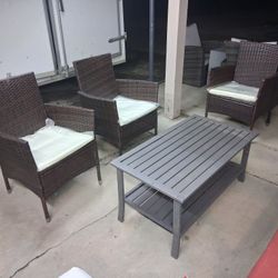3 Patio Chairs And a Table