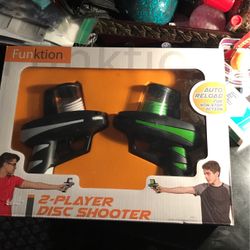 2 Players Disc Shooter  Función.