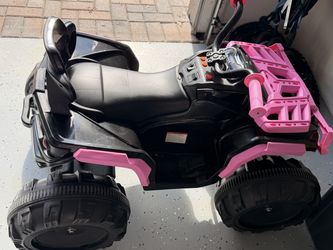 12V Kids Ride-On ATV with treaded wheels and front-rack detailing