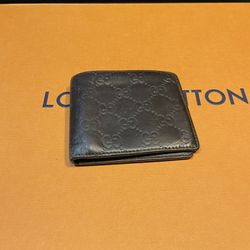 Gucci Monogram Embossed Wallet
