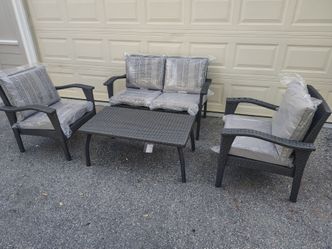 Outdoor patio wicker couch with chairs and coffee table