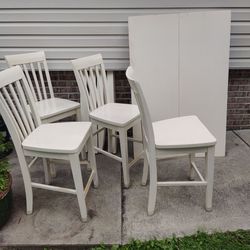 Dining room table and 4 bar height matching chairs