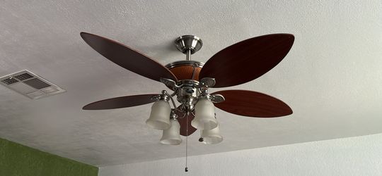 Fancy stainless steel, wood and wicker Harbor Breeze Fan. In NE by Dyer/Fairbanks.