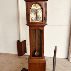 Grandfather Clock needs work  but In good condition 